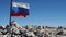 A battered and slightly torn Russian flag is flying at the top of the mountain. National Nature Reserve