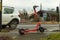 Battery powered electric scooter vehicle left on pedestrian footpath near motorway in england uk