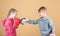 Battle for attention. Child sporty athlete practicing boxing skills. Boxing sport. Children wear boxing gloves while