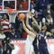 A Battle Beneath as Arizona Center Dusan Ristic Attempts a Layup