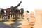 The battle of dinosaurs with chess on a chessboard