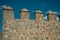 Battlement with merlons and crenels over stone wall at Avila