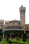 A battlement tower of bangalore palace view with beautiful garden.