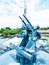 Battleship machine gun against a blue cloudy sky