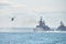 Battleships war ships corvette during naval exercises and helicopter maneuvering over sea, warships