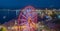 Batumi, Georgia - 2018: ferris wheel on the embankment at night from above