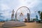 Batumi, Georgia - August 13 2021: Ali and Nino Statue and Ferris wheel on embankment of Batumi at sunny day