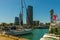 BATUMI, GEORGIA: Boats on the pier and skyscrapers in Batumi on a sunny day.