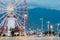 Batumi Georgia. Close Ferris Wheel Behind Old White Lighthouse A