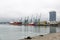 Batumi, Georgia - June 26, 2021: View of the seaport of Batumi. Port cranes. Cargo terminal. Ships and berths.