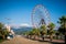 Batumi Seafront Boulevard with ferris wheel and mountains in the background