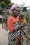 Batwa Pygmy woman and grandchildren in Burundi