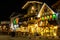 Bauernhaus style Bavarian buildings at night with Christmas lights