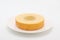 Baumkuchen German doughnut cake on plate on white background