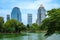 Bautiful view of lake and modern buildings in Lumpini Park, Bangkok, Thailand