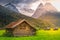 Bavarian alps and rustic farm barn, Garmisch, Zugspitze massif, Bavaria, Germany