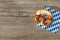 Bavarian bread pretzel vintage wooden board background