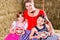 Bavarian family sitting on hayloft with gingerbread