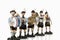 Bavarian figurines playing music on white background