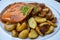 Bavarian fine meatloaf with onion sauce and roast potatoes