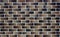 Bavarian masonry. Image of brickwork with a transition of color from light brown to dark brown.