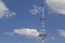 Bavarian maypole in front of white blue cloud sky