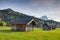 Bavarian rural scenery of timber barns, meadows and mountains