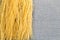 Bavette pasta spaghetti on a burlap cloth with a dark background