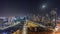 Bay Avenue with modern towers residential development in Business Bay aerial panoramic all night timelapse, Dubai