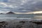 Bay of El Medano panorama with kitesurfers, Atlantic Ocean and dark clouds on Canary Island Tenerife, Spain