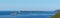 Bay Gertsegnovska in Adriatic Sea. Island Mamula or Lastavica with Fort. Calm sea and clear blue sky. Panorama