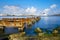 The Bay of Havana and the Old Havana skyline with a rusty iron pier on the foreground