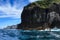 Bay of Islands, New Zealand. The steep cliffs of Motukokako Island