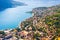 Bay of Kotor in Montenegro with view of mountains, boats and old houses with red tile roofs