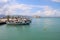 In the bay of Nafplio, Peloponnese, Greece. Boats on a mole, the historic Bourtzi castle in the background