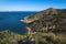 Bay in the natural park Serra Gelada with lighthouse and the Rock `Ifach` of Calpe in the background, Albir, Costa Blanca, Spain