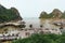 Bay near Thien Cung Cave with many boats and tourists in summer at Ha Long Bay in Quang Ninh, Vietnam