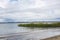 Bay with sand and grass at Jamaica bay wildlife refuge with nyc background