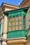 Bay window, enclosed window, architectural details, a fragment of a building protruding from the facade, green bay window, archite