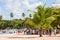 BAYAHIBE, DOMINICAN REPUBLIC - MAY 21, 2017: Tourists near boats. caribbean landscape. Copy space for text.