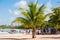 BAYAHIBE, DOMINICAN REPUBLIC - MAY 21, 2017: Tourists near boats. caribbean landscape. Copy space for text.