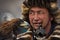 BAYAN-ULGII, MONGOLIA - OCTOBER 01, 2017: Golden Eagle Festival. Portrait Of Unknown Mongolian Hunter With Expressive Sight And Ru