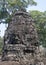 Bayon is remarkable for the 216 serene and smiling stone faces on the many towers jutting out from the high terrace and cluster