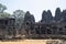 Bayon is remarkable for the 216 serene and smiling stone faces on the many towers jutting out from the high terrace and cluster