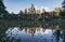 Bayon Wat temple panoramic reflection in lake water at sunset, Cambodia