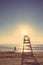 Baywatch chair in beach at summer sunset