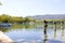 BaÃ±ola lake with ducks, boats