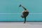 BBOY dancing breakdance against a blue wall