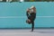 BBOY dancing breakdance against a blue wall