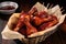 bbq chicken drumsticks arranged in a paper-lined basket